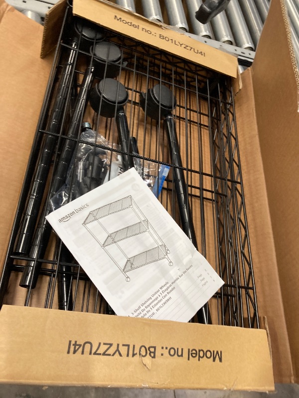 Photo 1 of **It is used, it is missing a part and it is not known if it works 100% because it did not come with the connector***Amazon Basics 4-Shelf Adjustable Heavy Duty Steel Wire Rack Storage Shelving Organizer for Kitchen, Garage, 36" L x 14" W x 54" H, Black