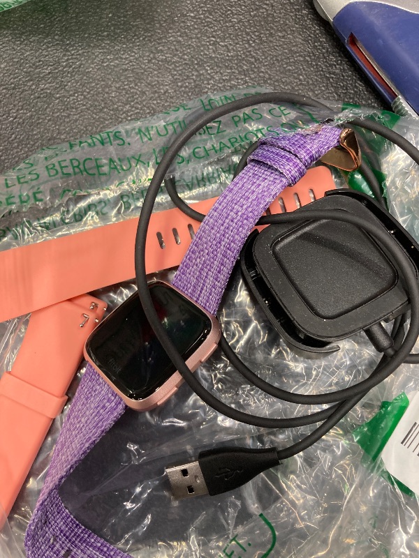 Photo 1 of *Didn't turn on/Parts Only* Fitbit Versa Special Edition Smart Watch, Lavender Woven, One Size (S & L Bands Included)