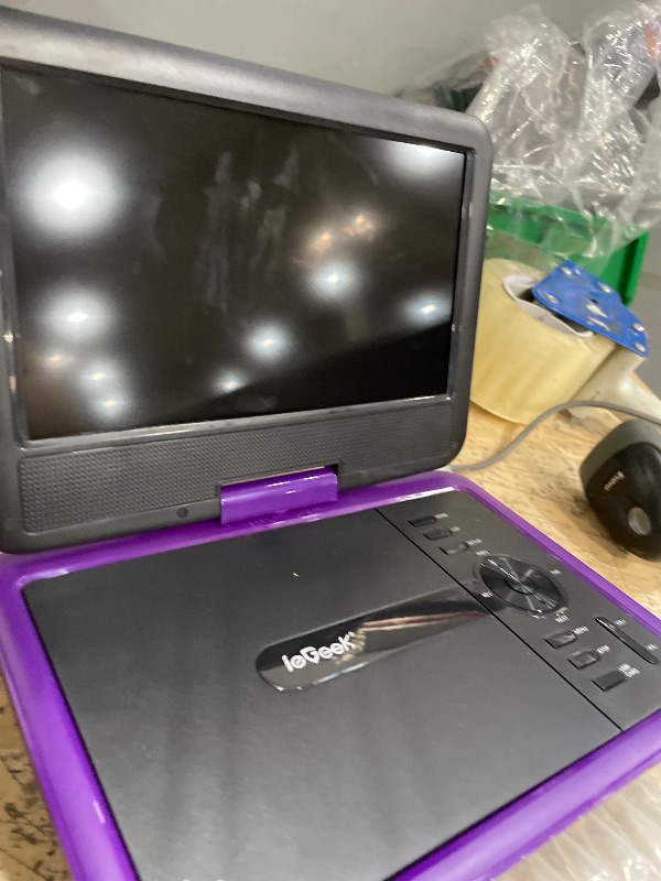 Photo 1 of **PICTURED TAG NUMBER NOT CORRECT PHOTO FOR PACKAGING REFERENCE*** ieGeek 11.5" Portable DVD Player for Kids and Car, 9.5" Eye-Protective Screen with 5 Hours Rechargeable Battery, Support Sync TV/USB/SD Card and Multiple Disc Formats, Region Free - Purple