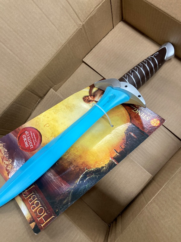 Photo 1 of **NON RETURNABLE**
**NON REFUNDABLE**

Lord Of The Rings: Bilbo Baggins Sting Light up Sword for Kids by Rubies, No Size