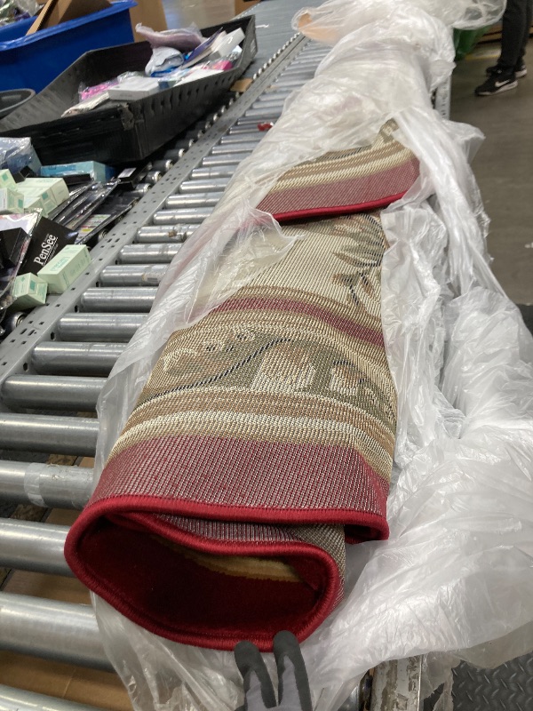 Photo 1 of *Size unknown* Red and gold pattern area rug, Circular 