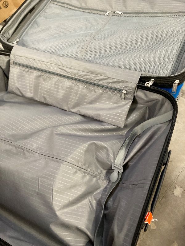 Photo 1 of ***DAMAGE -ZIPPER BROKEN -SELLING AS IS *** Amazon Basics 30" Hardside Large Checked Luggage, Expandable For Up to 15% More Space, With Scratch-Resistant Surface, Four Multi-directional Wheels, Telescoping Handle, Light Blue