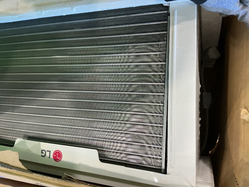 Photo 1 of *MAJOR DAMAGE*
LG 12,200 BTU Window Air Conditioner with Supplemental Heat, 230/208V, Cools 570 Sq.Ft. (19' x 30' Room Size), Electronic Controls with Remote, 2 Cooling, Heating & Fan Speeds, Slide In-Out Chassis