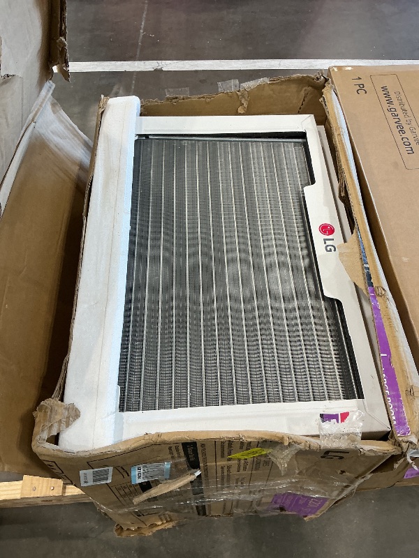 Photo 1 of *MAJOR DAMAGE*
LG 12,200 BTU Window Air Conditioner with Supplemental Heat, 230/208V, Cools 570 Sq.Ft. (19' x 30' Room Size), Electronic Controls with Remote, 2 Cooling, Heating & Fan Speeds, Slide In-Out Chassis