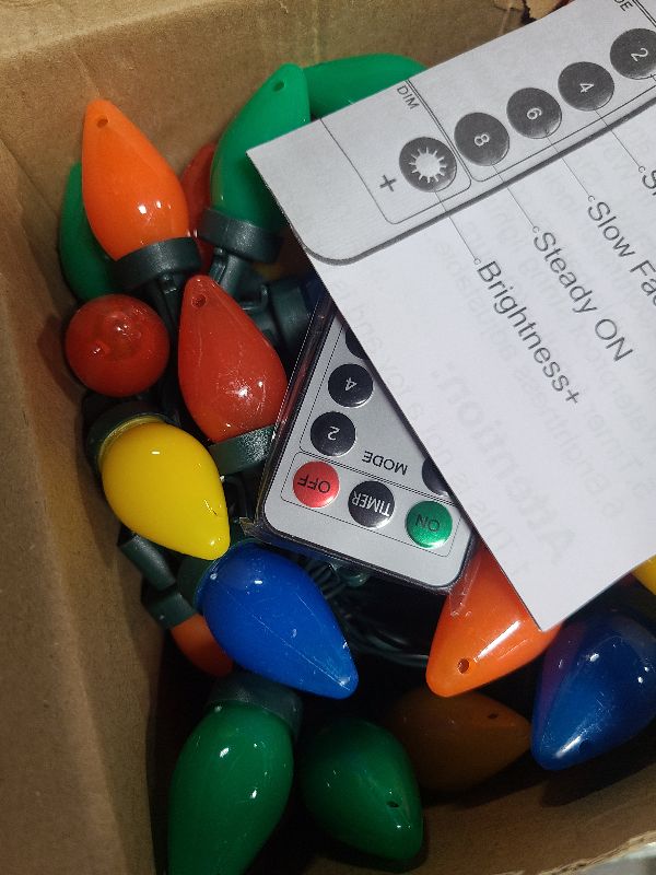 Photo 1 of 100 LED C7 Multicolor Christmas Lights Battery Operated with 8 Mode Remote Control, 2 Sets 27.5FT Colorful Christmas Tree Lights with 2 * 50pcs Twinkle C7 Light Bulbs for Home Porch Yard Decorations