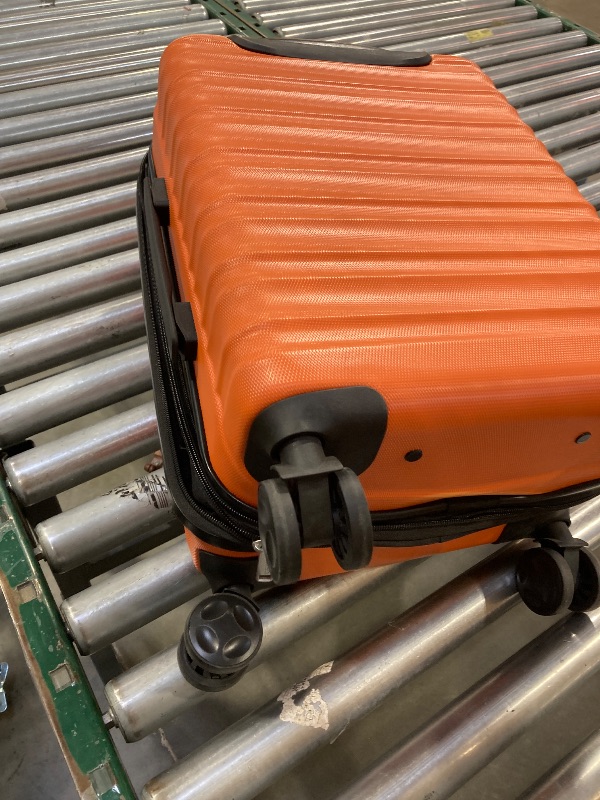 Photo 1 of AmazonBasics Hardside Carry On Spinner Travel Luggage Suitcase - 21 Inch, Orange