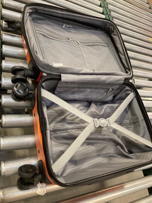 Photo 1 of AmazonBasics Hardside Carry On Spinner Travel Luggage Suitcase - 21 Inch, Orange