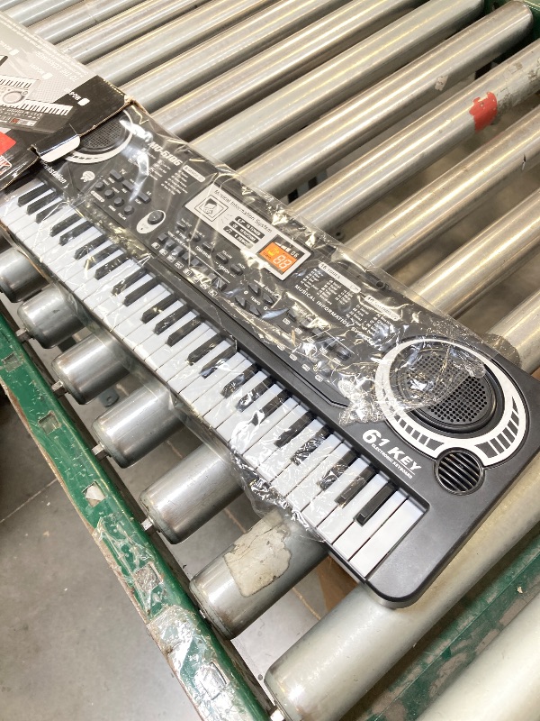 Photo 1 of 61 Key Piano Keyboard, Beginner Electronic Keyboard for Kids with Teaching Mode, 6 Demo Songs, 16 Tones, Microphone and Power Supply, Kids Piano Keyboard for Birthday Gift/Christmas Gift