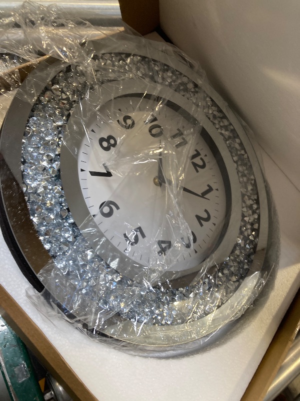 Photo 1 of DMDFIRST Crystal Crushed Diamond Mirrored Round Wall Clock 16x16x2 inches for Wall Decoration Silver Glass Mirror Clock Sparkle Twinkle Bling Home Decor. AA Battery is not Included.