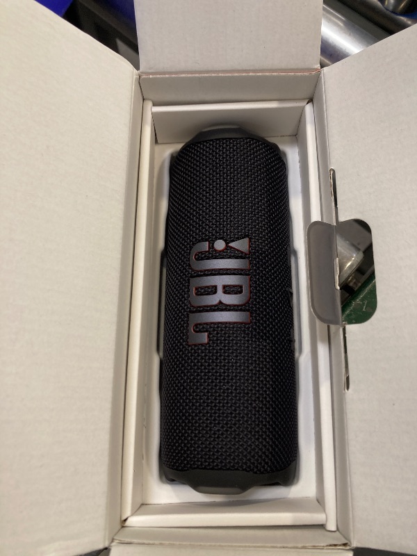Photo 1 of JBL Flip 7 - Portable Waterproof and Drop-Proof Speaker, Bold Pro Sound with AI Sound Boost, 16Hrs of Playtime, and PushLock System with Interchangeable Accessories (Black)