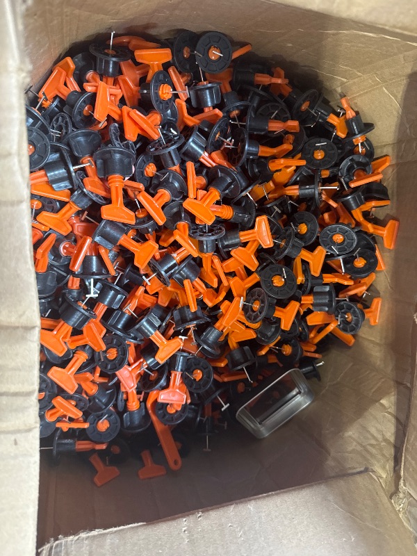 Photo 1 of Box Full of Tile Spacers