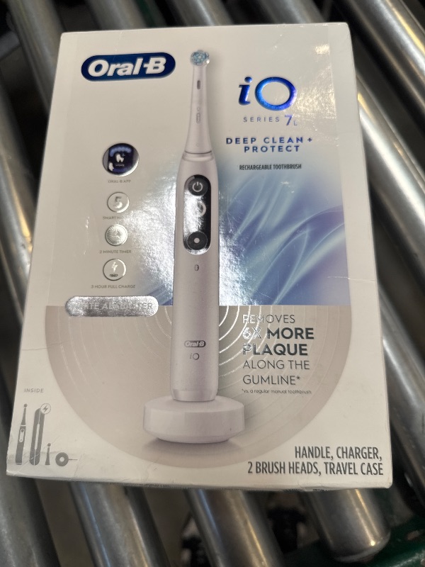 Photo 1 of Oral-B iO Deep Clean + Protect Rechargeable Electric Toothbrush, White with a iO Series 7 Toothbrush, 2 Replacement Brush Heads, and a Charging Travel Case