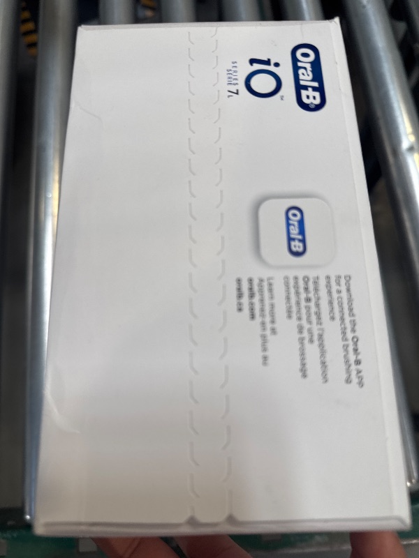 Photo 1 of Oral-B iO Deep Clean + Protect Rechargeable Electric Toothbrush, White with a iO Series 7 Toothbrush, 2 Replacement Brush Heads, and a Charging Travel Case