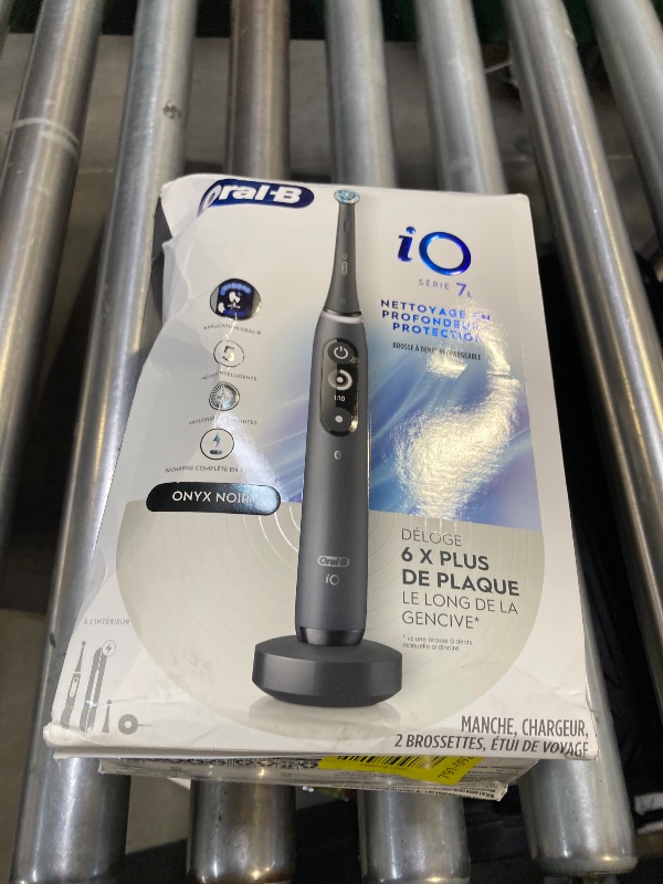 Photo 1 of Oral-B iO Deep Clean + Protect Rechargeable Electric Toothbrush, Black with a iO Series 7 Toothbrush, 2 Replacement Brush Heads, and a Charging Travel Case
