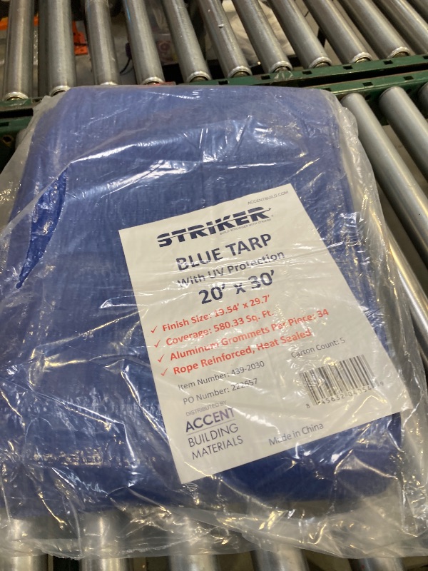 Photo 1 of Striker Blue Tarp 20' x 30' - All Purpose PE Cover with UV Protection, 34 Rust-Resistant Grommets, and Rope-Reinforced Edges
