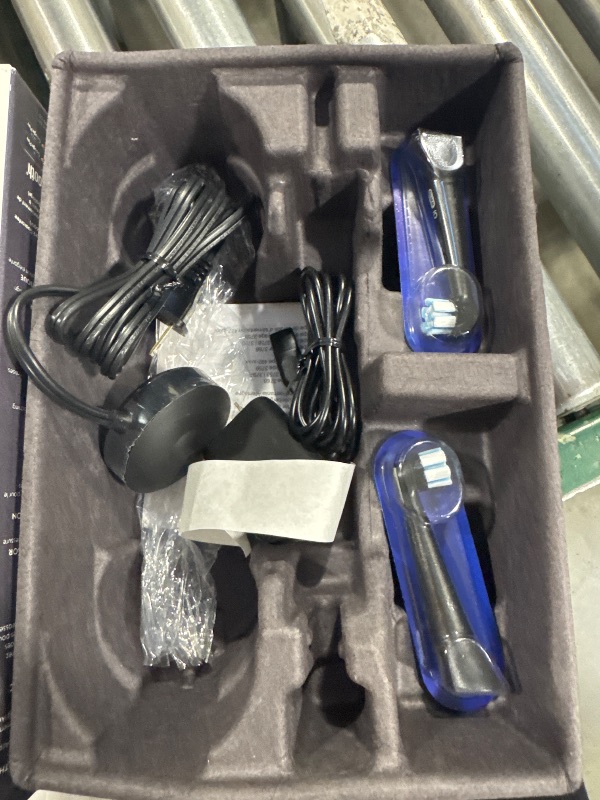 Photo 1 of Oral-B iO Deep Clean + Protect Rechargeable Electric Toothbrush, Black with a iO Series 7 Toothbrush, 2 Replacement Brush Heads, and a Charging Travel Case