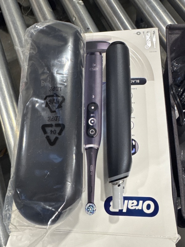 Photo 1 of Oral-B iO Deep Clean + Protect Rechargeable Electric Toothbrush, Black with a iO Series 7 Toothbrush, 2 Replacement Brush Heads, and a Charging Travel Case
