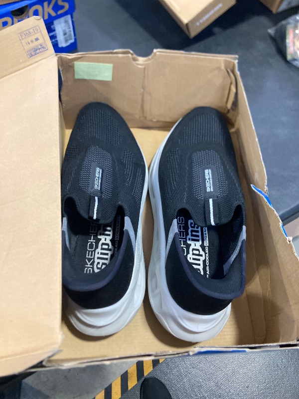 Photo 1 of Skechers Men's Max Cushioning Glide Step Euclid Hands Free Slip-Ins Sneaker, Black/Gray, 10