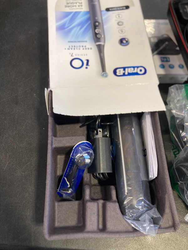 Photo 1 of Oral-B iO Deep Clean + Protect Rechargeable Electric Toothbrush, Black with a iO Series 7 Toothbrush, 2 Replacement Brush Heads, and a Charging Travel Case