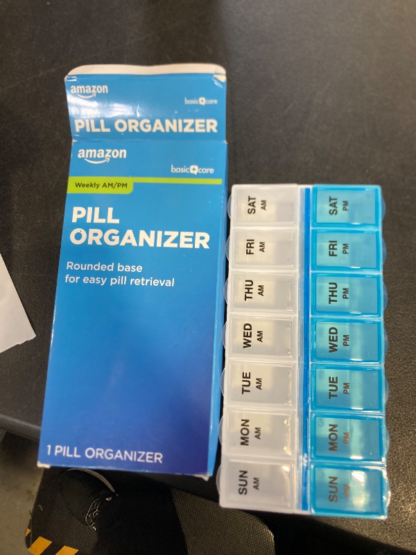 Photo 1 of Amazon Basic Care (7-Day) AM/PM Pill Organizer, Vitamin Case, And Medicine Box, Large Compartments, 2 Times a Day, Blue and Clear Lids