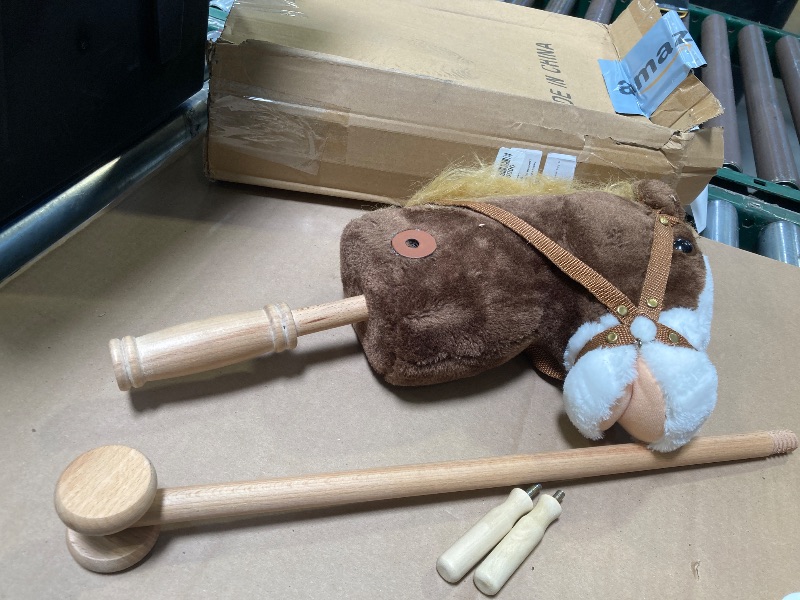 Photo 1 of HollyHOME Stick Horse Plush Handcrafted Hobby Horse on a Stick with Wood Wheels Real Pony Neighing and Galloping Sounds for Kids Toddlers Chocolate 36 Inches(AA Batteries Required)