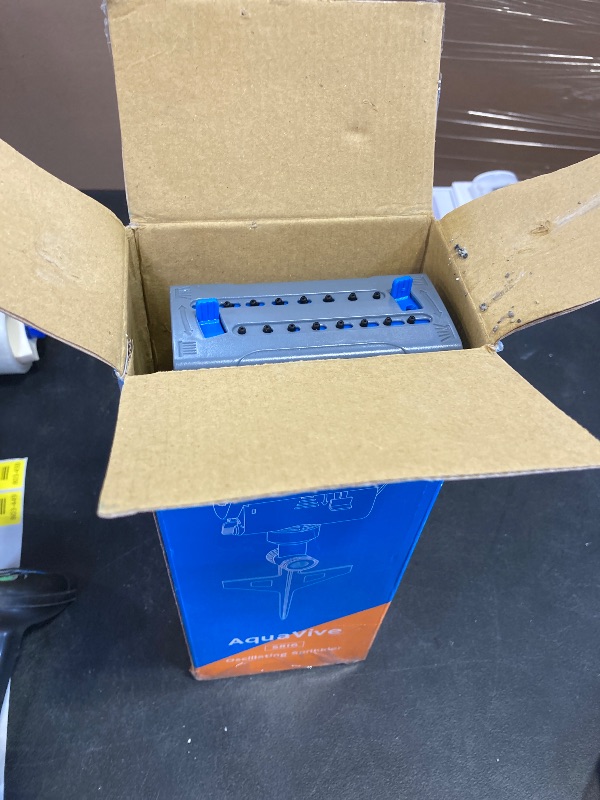 Photo 1 of Airthereal Oscillating Sprinkler with Metal Step Spike and Quick Connect Adapter Set, Control Watering Range, Width, and Flow Rate, Covers up to 4,069 sq.ft., Blue