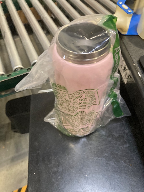 Photo 1 of Owala FreeSip Insulated Stainless Steel Water Bottle with Straw for Sports and Travel, BPA-Free Sports Water Bottle, 32 oz, Pink, Angel Food Cake