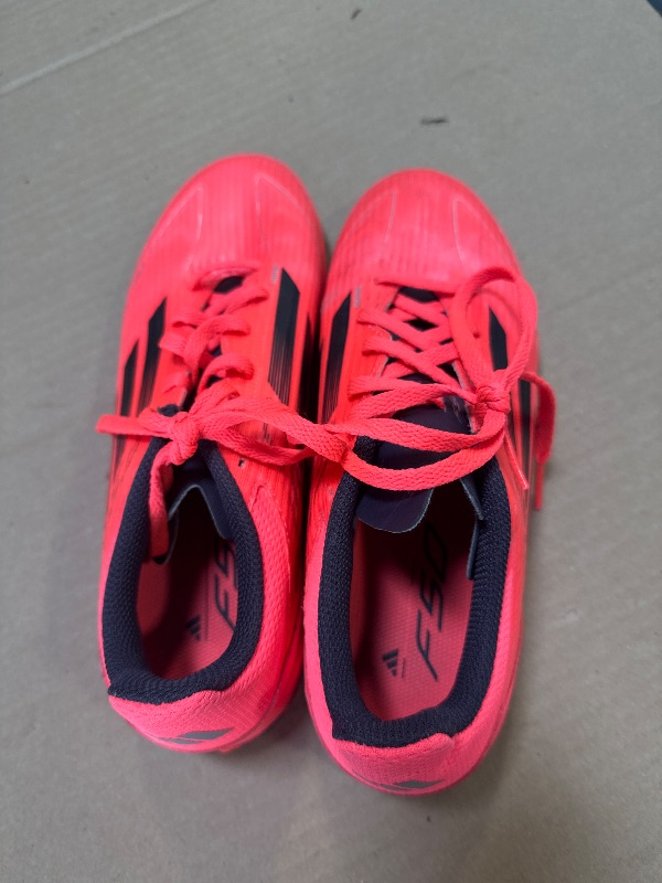 Photo 1 of adidas F50 League Turf Sneaker, Turbo/Aurora Black/Platin Metallic, 6 US Unisex Big Kid