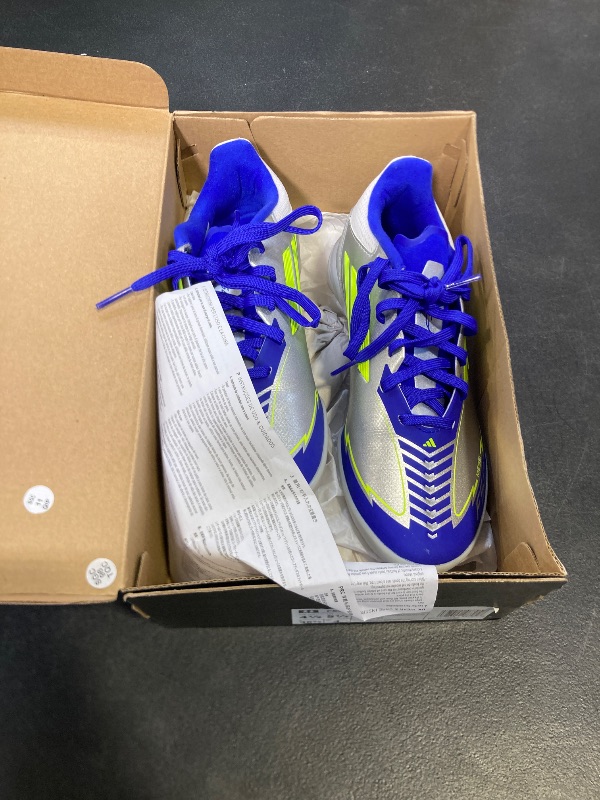Photo 1 of adidas Unisex-Adult F50 League Messi Turf Soccer, Silver Metallic/Solar Yellow/Lucid Blue, 4.5