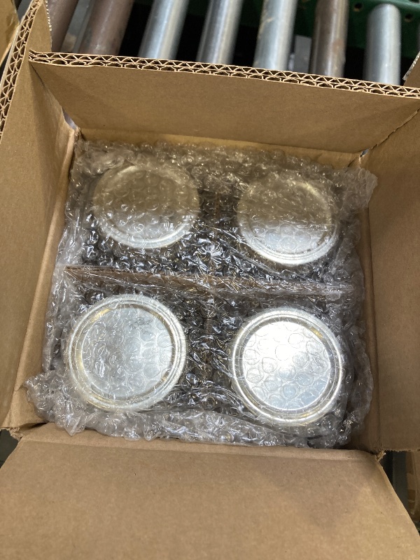 Photo 1 of Ball Glass Mason Jars with Lids and Bands, Used for Canning, Pickling, Juice, Jam, Jelly (Quart, 32 Ounce (Pack of 4))