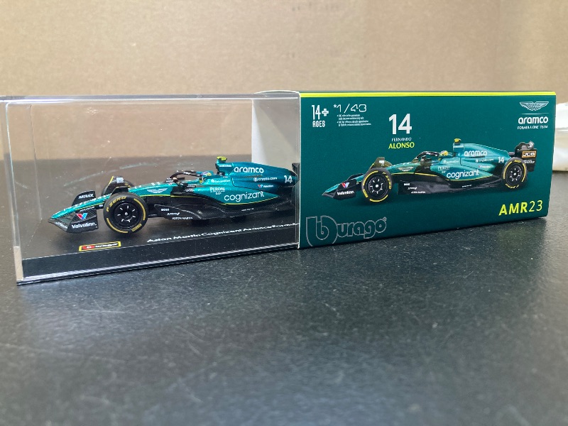 Photo 1 of Bburago 1:43 Race Aston Martin AMR23 (2023) w/Driver