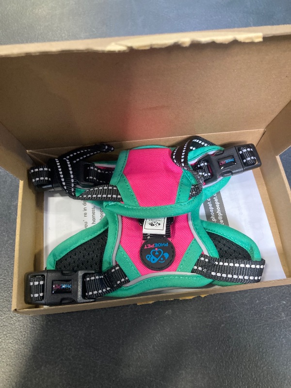 Photo 1 of PHOEPET 2019 Upgraded No Pull Dog Harness, Reflective Adjustable Vest, with a Training Handle + 2 Metal Leash Hooks+ 3 Snap Buckles +4 Slide Buckles(XS, Pink)