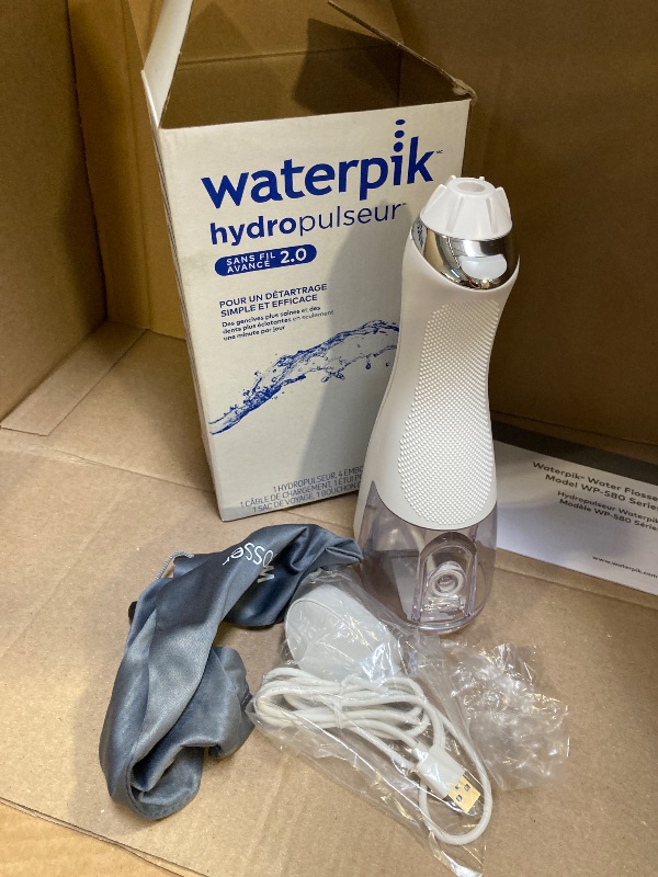 Photo 1 of Waterpik Cordless Advanced 2.0 Water Flosser For Teeth, Gums, Braces, Dental Care With Travel Bag and 4 Tips, ADA Accepted, Rechargeable, Portable, and Waterproof, White WP-580