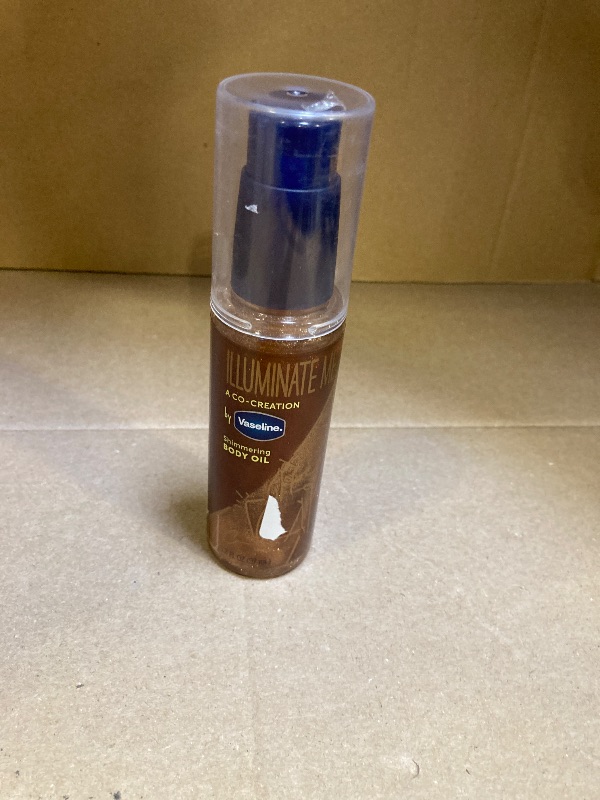 Photo 1 of Vaseline Illuminate Me Shimmering Body Oil Created for Melanin Rich Skin, Illuminates Skin with Finishing Touch of Shimmer for Glowing Skin 3.3 oz