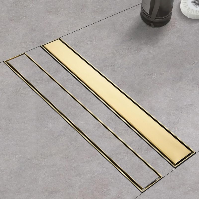 Photo 1 of Linear Shower Drain ?with Tile Insert Panels ?24 Inch Brushed Gold 304 Stainless Steel Rectangle Shower Floor Drain?with Hair Catcher, Adjustable Feet
