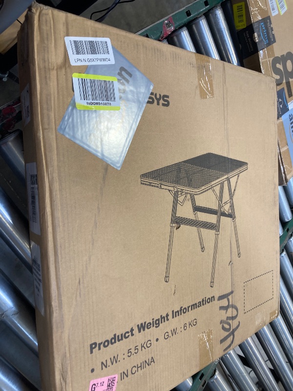 Photo 1 of Foldable Grill Table with Mesh Desktop, 200lbs 3Ft Portable Folding Table, Height Adjustable Metal Table for Ourdoor, Camping, Picnic, BBQ and Beach, RV, 35.4" L x 23.6" W	