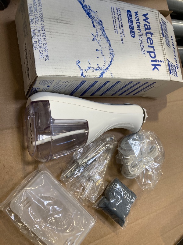 Photo 1 of Waterpik Cordless Advanced 2.0 Water Flosser For Teeth, Gums, Braces, Dental Care With Travel Bag and 4 Tips, ADA Accepted, Rechargeable, Portable, and Waterproof, White WP-580, Packaging May Vary