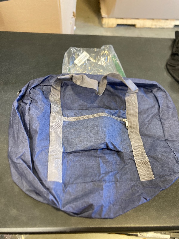 Photo 1 of blue and grey duffle bag