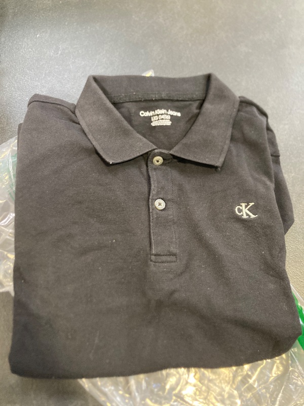 Photo 1 of Calvin Klein Boys' Short Sleeve Micro Pique Solid Polo, Black EB70, 14-16