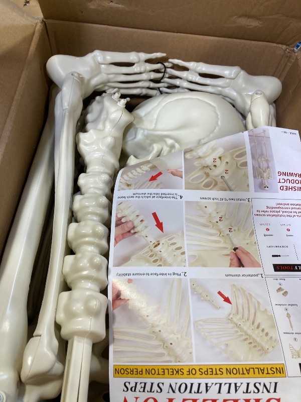 Photo 1 of Abakuku 5.4 ft Posable Halloween Skeleton Decorations,Human Bones for Halloween Party with Movable Joints,for Haunted Houses, Front Lawn, Graveyard Props