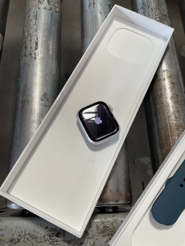 Photo 1 of **LOCKED*** Apple Watch Series 9 [GPS 41mm] Smartwatch with Silver Aluminum Case with Storm Blue Sport Band S/M. Fitness Tracker, Blood Oxygen & ECG Apps, Always-On Retina Display