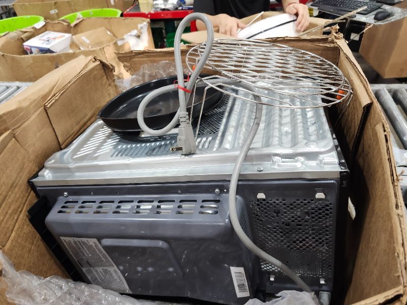 Photo 1 of *************button panel was undone and button does not work to open door**************
GE GCST10A1WSS 4-in-1 Microwave Oven, 1,050 Watts Air Fryer, Broiler & Convection Mode, Child-Lock Technology, Kitchen Essentials for The Countertop or Dorm Room, 1.0