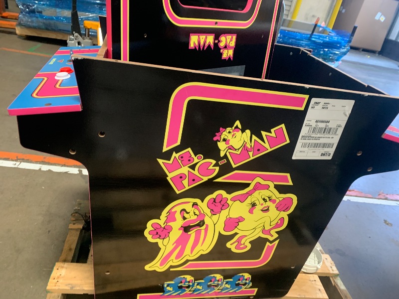 Photo 1 of **see note **Arcade1Up Ms.PAC-Man Head-to-Head Arcade Machine – Retro Home Arcade Table with 12 Classic Games, Light-Up Control Deck & Real-Feel Joysticks