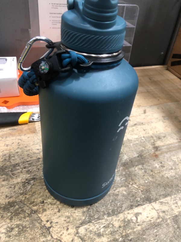 Photo 1 of *************MISSING ALLACCESSORIES**************
Swigina [2-IN-1 LID] 64 oz Insulated Water Bottle with Silicone Boot (48hrs Cold/24hrs Hot) - DIY Stickers, Leakproof, BPA Free, Half Gallon