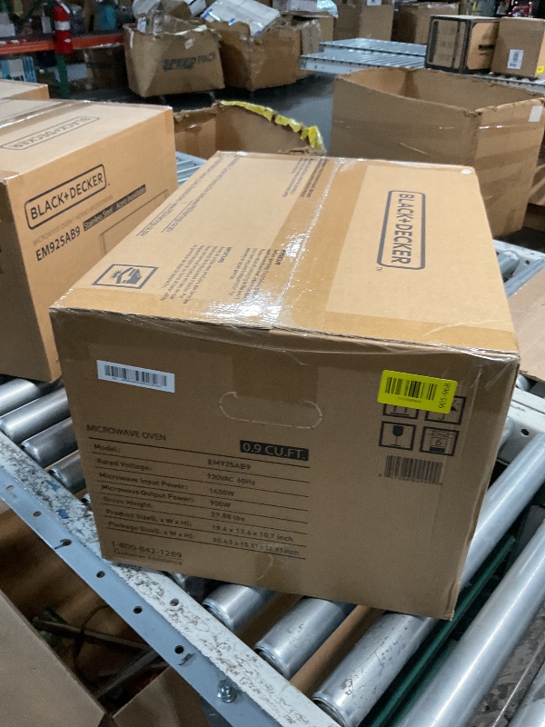 Photo 1 of *** FACTORY SEALED *** BLACK+DECKER Digital Microwave Oven with Turntable Push-Button Door, Child Safety Lock, Stainless Steel, 0.9 Cu Ft