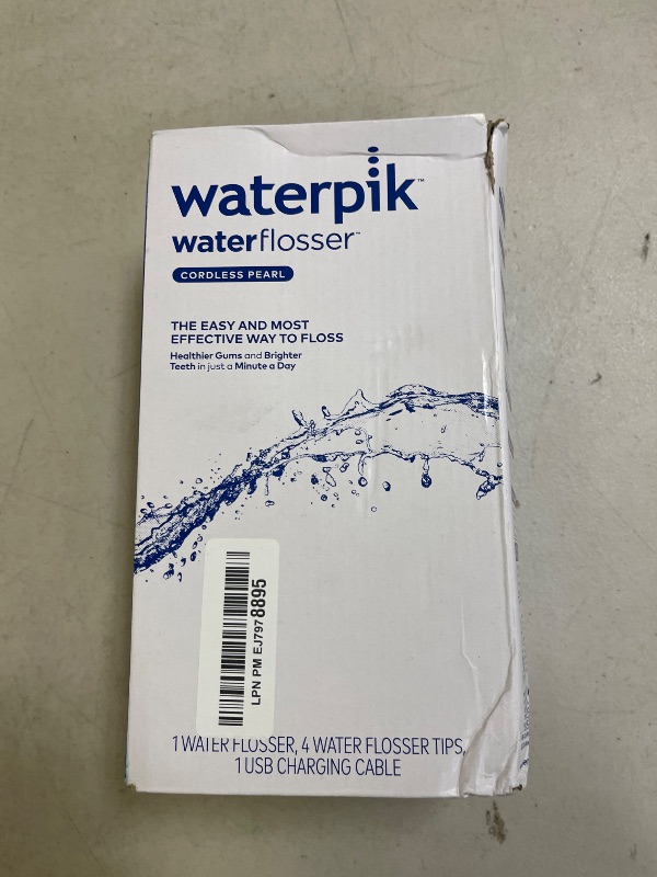 Photo 1 of Waterpik Cordless Pearl Rechargeable Portable Water Flosser for Teeth, Gums, Braces Care and Travel with 4 Flossing Tips - ADA Accepted, WF-13 White, Packaging May Vary