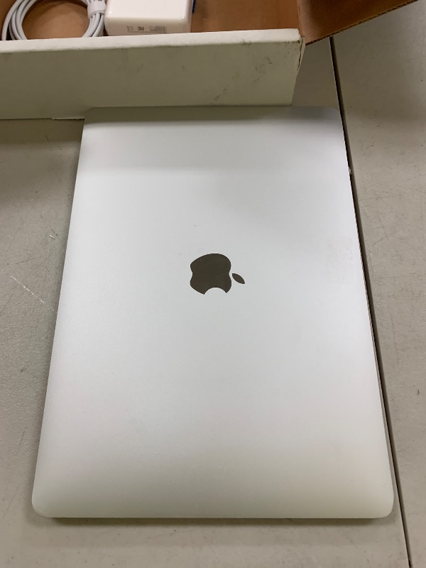 Photo 1 of Apple 2020 MacBook Air with 1.1GHz Intel Core i3, 13-inch, 8GB RAM, 128GB SSD Storage Space Gray (Renewed)
