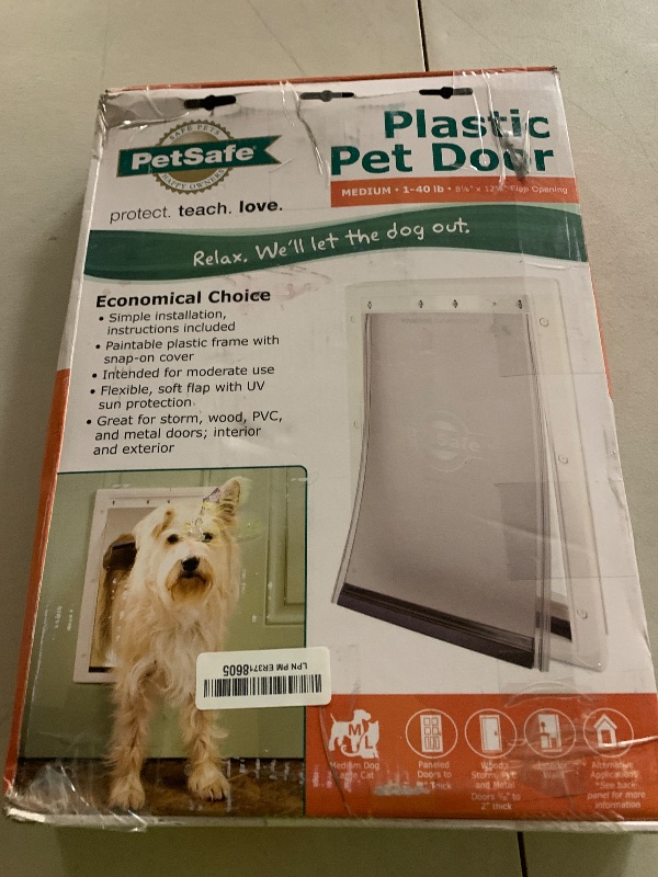 Photo 1 of PetSafe Plastic Pet Door - Easy Install for Wood, PVC Metal & Paneled Doors - Rust-Free Plastic Frame - Flap Dimensions 8 1/4" W x 12 1/4" H - for Medium Dogs Weighing Up to 40 lb
