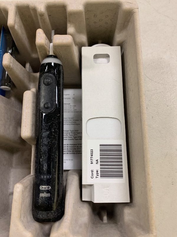Photo 1 of Oral-B Genius X Limited Rechargeable Electric Toothbrush with 1 Replacement Brush Head, Travel Case, Midnight Black