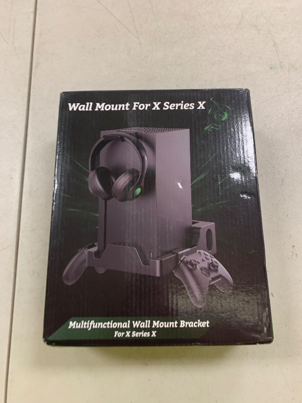 Photo 1 of Wall Mount for Xbox Series X Console - Sturdy Wall Shelf Kit Load Up to 45Lb, Dual Ventilation Design, Place Xbox Front Facing and Prevent from Falling (with 2 Controller Holder and 1 Headphone Stand)